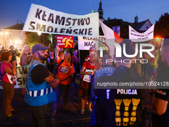 People demonstrate holding banners during an anti-government protest in Krakow, Poland on September 18, 2023. Protestors organized a rally a...