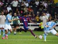 Lamine Yamal right winger of Barcelona and Spain does passed during the LaLiga EA Sports match between FC Barcelona and Celta Vigo at Estadi...