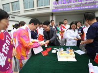 Doctors, nurses and volunteers hold a ceremony at Shaoxing Central Hospital to celebrate the completion of the task of providing medical car...