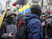 Ukrainian radical protestors throws a stones at the office of a bank 