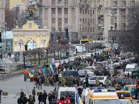The column of radical nationalists marsh to the office of russian Alfa-Bank, as they protest against the Russian presence in Ukraine, in dow...