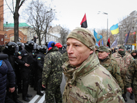 Special police forces and National Guards are seen patrolling the street next to the Sberbank of Russia office as radical nationalists prote...