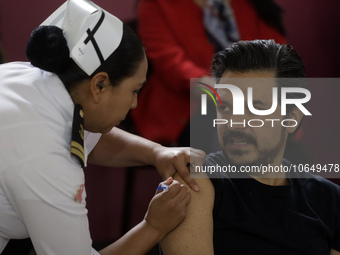 October 16, 2023, Mexico City, Mexico: The director of the Mexican Social Security Institute, Zoe Robledo, is vaccinated against influenza a...