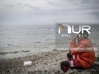 A volunteer looking for incoming boats with Migrants in Mytilene, island of Lesbos, Greece, on February 24, 2016. More than 110,000 migrants...
