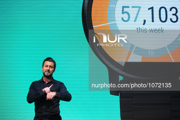 A congressman showing the Motorola Moto 360, during the last  day of Mobile World Congress in Barcelona, 24th of February, 2016. 
