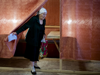 UKRAINE, Slavyansk : A woman exits a polling station prior to vote for the referendum called by pro-Russian rebels in eastern Ukraine to spl...