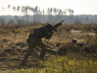 Servicemen of the First Presidential National Guard Brigade of Ukraine BUREVIY (Storm) during a practical exercise at a training ground in n...