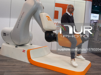 A trade fair attendee is testing the intelligent motion system at the Medica Fair 2023 in Dusseldorf, Germany, on November 13, 2023. (
