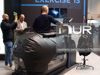 A trade fair attendee is testing an anti-gravity treadmill for pain-free physical rehabilitation training at the Medica Fair 2023 in Dusseld...
