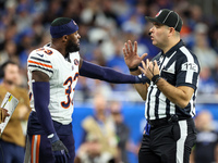 Chicago Bears cornerback Jaylon Johnson (33) discusses a call with down judge Brian Sakowski (112) during  an NFL  football game between the...