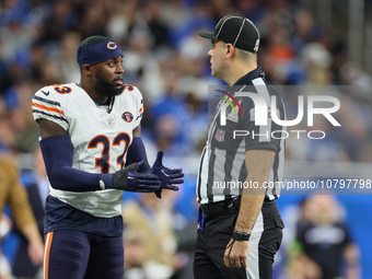 Chicago Bears cornerback Jaylon Johnson (33) discusses a call with down judge Brian Sakowski (112) during  an NFL  football game between the...