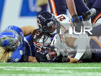 Chicago Bears quarterback Justin Fields (1) is sacked by Detroit Lions linebacker Alex Anzalone (34) during  an NFL  football game between t...