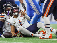 Chicago Bears quarterback Justin Fields (1) reacts after being sacked by Detroit Lions linebacker Alex Anzalone (34) during  an NFL  footbal...