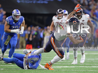 Chicago Bears wide receiver DJ Moore (2) runs the ball against Detroit Lions safety Kerby Joseph (31) during the first half of an NFL footba...