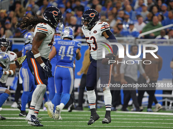 Chicago Bears linebacker T.J. Edwards (53) celebrates with linebacker Tremaine Edmunds (49) after an interception during the first half of a...