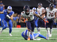 Chicago Bears wide receiver DJ Moore (2) runs the ball against Detroit Lions safety Kerby Joseph (31) during the first half of an NFL footba...