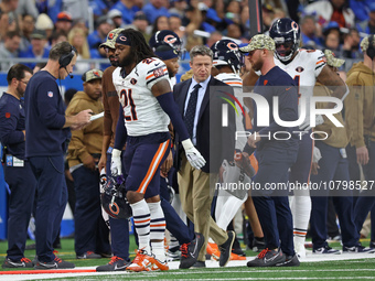Chicago Bears running back D'Onta Foreman (21) is taken off the field after an ankle injury during the second half of an NFL football game b...