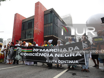 Protesters participate in a march to mark the celebrations for the 20th anniversary of the establishment of Black Consciousness Day, on Aven...