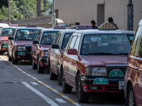 Taxis waiting for customers at a taxi stand on November 21, 2023 in Hong Kong, China. Around 500 Hong Kong Taxis set to participate in a str...