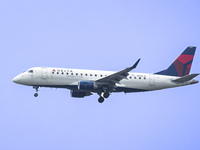 Delta Connection Embraer ERJ-175 passenger airplane operated by Republic Airlines spotted flying over Washington DC before landing at Ronald...