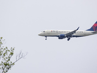 Delta Connection Embraer ERJ-175 passenger airplane operated by Republic Airlines spotted flying over Washington DC before landing at Ronald...