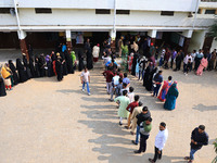 People are standing in queues to cast their votes for the Rajasthan Assembly elections in Jaipur, Rajasthan, India, on November 25, 2023. (