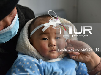 A 7-month-old baby is receiving infusion treatment at the Department of Pediatrics of the People's Hospital in Fuyang, Anhui province, China...