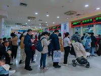 Parents and children with respiratory infectious diseases are waiting to see a doctor at the Children's Hospital in Chongqing, China, on Dec...