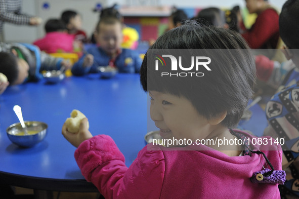 Chidlren wearing their cochleal implant at classroom of Deaf children rehabilitation school, Harbin city of China on march 2 2016.The Chines...