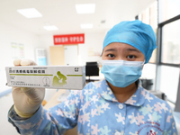 A medical worker at a community health service center is showing a flu vaccine in Guiyang, Guizhou Province, China, on December 7, 2023. (