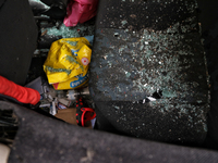 Glass shards are covering the back seat of a car after a Russian overnight attack in Odesa, southern Ukraine, on December 14, 2023. During t...