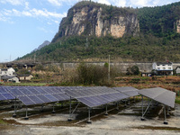A photovoltaic power station is being seen in a mountain village in Yichang, Hubei province, China, on December 25, 2023. According to the l...