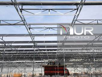 Workers are installing solar monocrystalline silicon panels at the ''photovoltaic power generation + agricultural planting'' park in Liyao t...