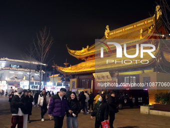 Citizens and tourists are celebrating the New Year at Guanqian Street in Suzhou, East China's Jiangsu province, on December 27, 2023. (