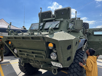 A boy is looking at a Canadian Armed Forces Light Armoured Vehicle (LAV) 6.0 on display in Toronto, Ontario, Canada, on September 16, 2023....