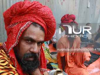 Sadhus and pilgrims are arriving at the Gangasagar Mela transit camp on their way to the annual Hindu festival at Gangasagar, where they wil...