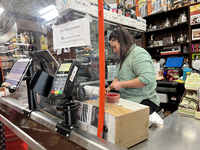 A cashier is working at a grocery store in Richmond Hill, Ontario, Canada, on September 23, 2023. Rising housing costs and an 11.4 percent i...