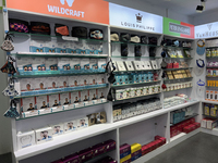 A shop is displaying specialty and designer face masks, along with hand sanitizer and other personal protective equipment to help protect ag...