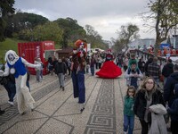 A group of costumed characters is entertaining visitors at a Christmas fair on the grounds of Eduardo VII Park in Lisbon, Portugal, on Decem...