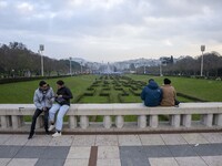 A group of people is observing the gardens from a viewpoint on the grounds of Eduardo VII Park in Lisbon, Portugal, on December 30, 2023. (