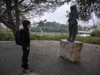 A person is observing statues on the grounds of Eduardo VII Park in Lisbon, Portugal, on December 30, 2023. (