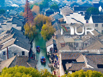 Tourists are visiting Zhouzhuang ancient town in Suzhou, Jiangsu Province, China, on December 31, 2023. (