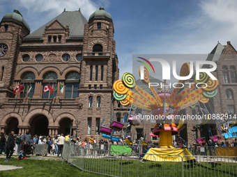 Canadians are enjoying a Royal Fair celebrating the coronation of King Charles III at the Ontario Legislature Building (Queen's Park) in Tor...