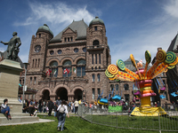 Canadians are enjoying a Royal Fair celebrating the coronation of King Charles III at the Ontario Legislature Building (Queen's Park) in Tor...
