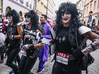 People dressed for members of Kiss band attend the traditional 19th Krakow New Year's Run in the Old Town in Krakow, Poland on December 31,...