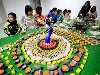 A photo taken in Liuzhou, China, on December 30, 2023, shows the Peacock of Pindehong in Banlan town, Rongan County. The dish primarily cons...