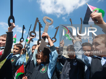 Palestinian children hold keys during a rally marking the Nakba or the ''Day of Catastrophe'' in front of the United Nations Development Pro...