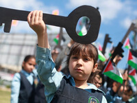 Palestinian children hold keys during a rally marking the Nakba or the ''Day of Catastrophe'' in front of the United Nations Development Pro...