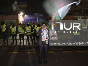An Iranian protester is holding a portrait of the former commander of the Islamic Revolutionary Guard Corps' (IRGC) Quds Force, General Qass...