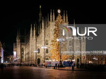 The Duomo Cathedral is standing in Duomo Square, Milan, Italy, during the Christmas period, on December 21, 2023. (